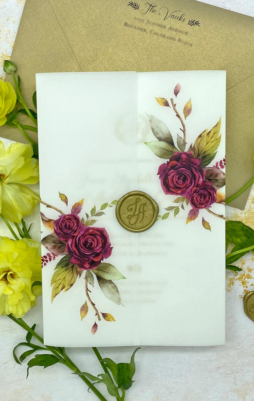 vellum invitation wrap with gold wax seal