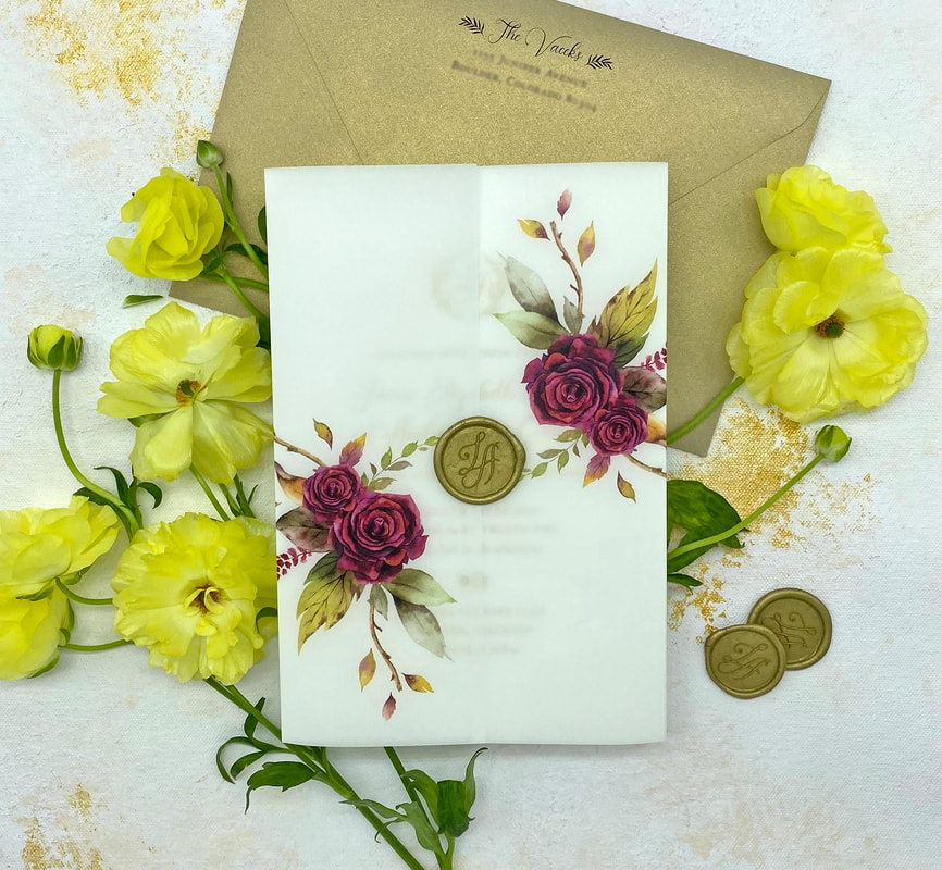 vellum invitation wrap with gold wax seal 