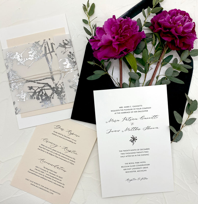 silver foil vellum wrapped wedding invitation